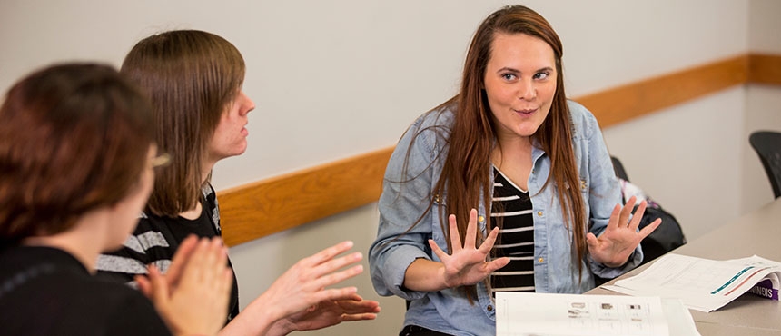 Students practicing sign language.